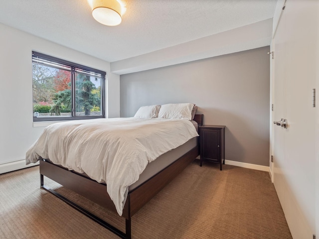 carpeted bedroom with baseboards and a textured ceiling