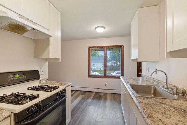 1022-1024 34th Ave N, Minneapolis, MN 55412 - kitchen featuring gas range, a sink, under cabinet range hood, baseboard heating, and white cabinetry