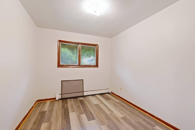 1022-1024 34th Ave N, Minneapolis, MN 55412 - unfurnished room with a baseboard radiator, light wood-type flooring, and baseboards