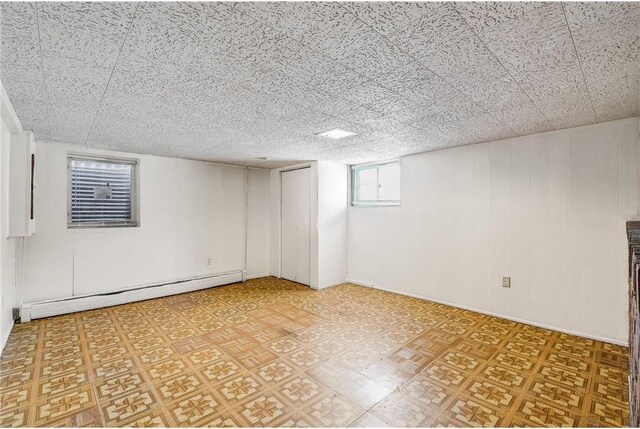 1022-1024 34th Ave N, Minneapolis, MN 55412 - below grade area featuring a baseboard radiator and light floors