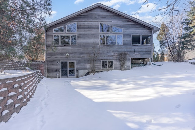 view of snow covered house