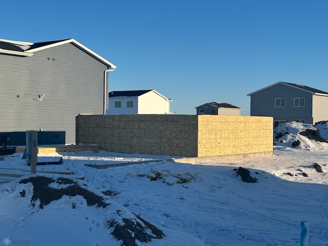 yard layered in snow with fence