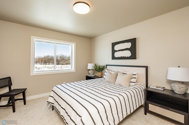 bedroom with carpet flooring and baseboards