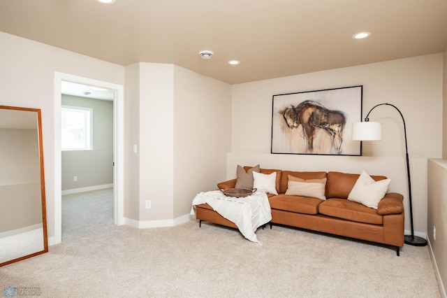 living area featuring recessed lighting, baseboards, and carpet