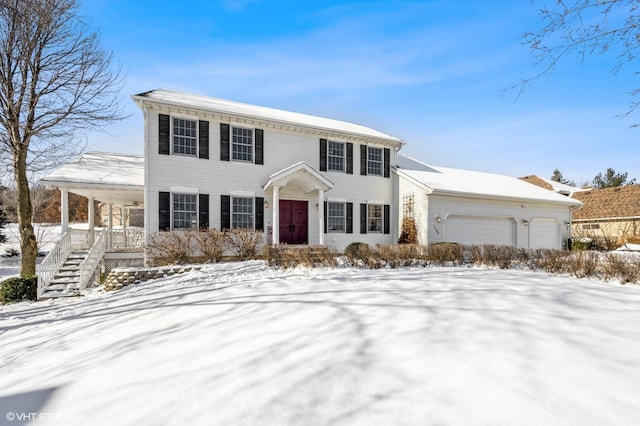 view of front facade featuring an attached garage and covered porch