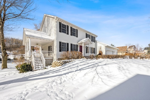 view of front of house featuring a garage and covered porch