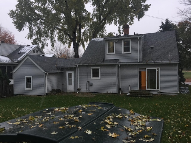 632 Morgan Ave S, Minneapolis, MN 55405 - back of property featuring a chimney and a lawn