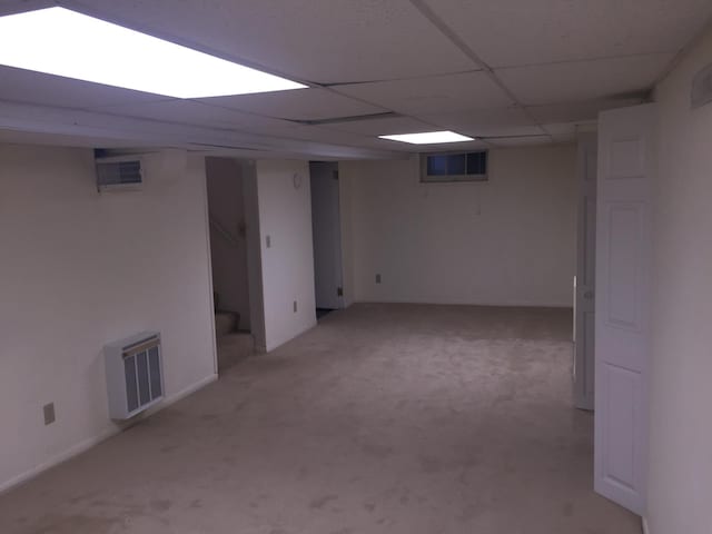 632 Morgan Ave S, Minneapolis, MN 55405 - finished below grade area featuring light carpet and stairway