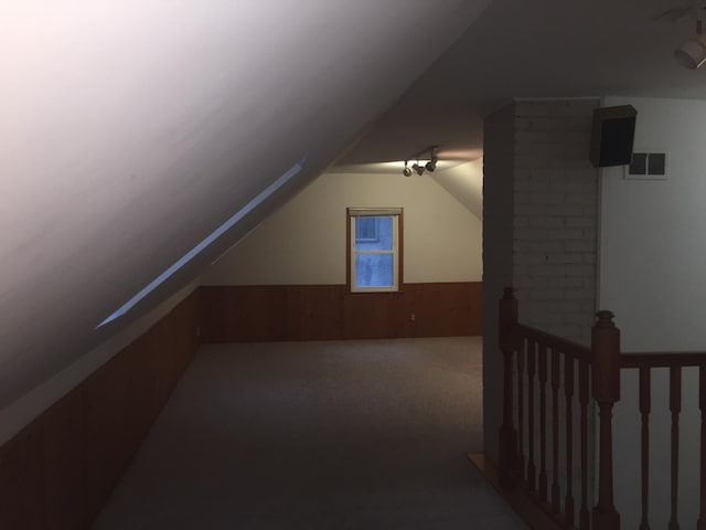 632 Morgan Ave S, Minneapolis, MN 55405 - additional living space with wainscoting, carpet, and vaulted ceiling