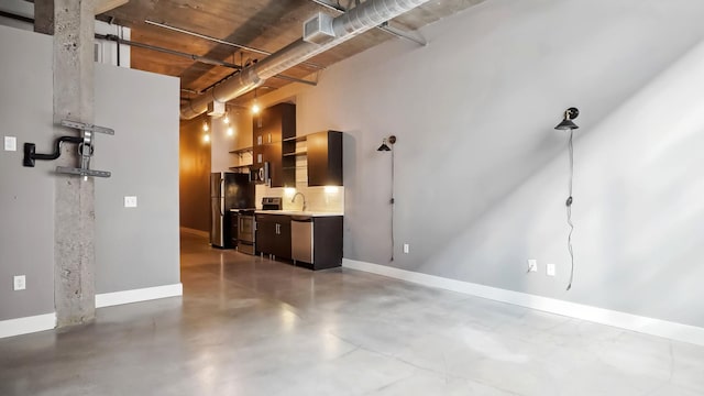 living area featuring finished concrete floors and baseboards