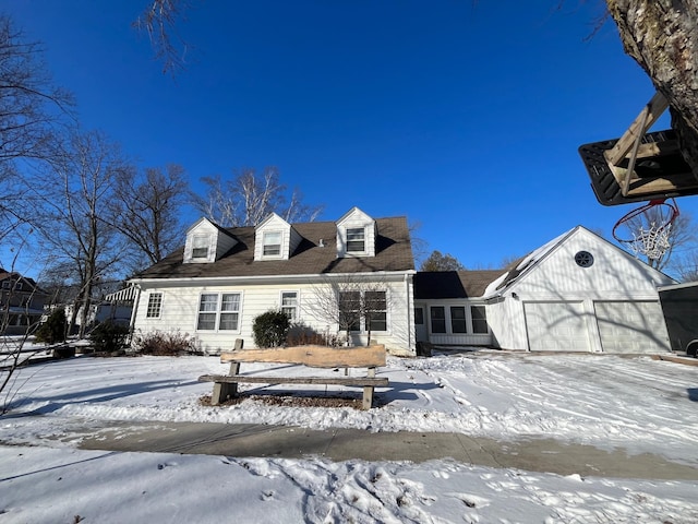 cape cod-style house with an attached garage