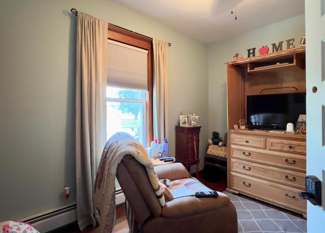 sitting room featuring baseboard heating