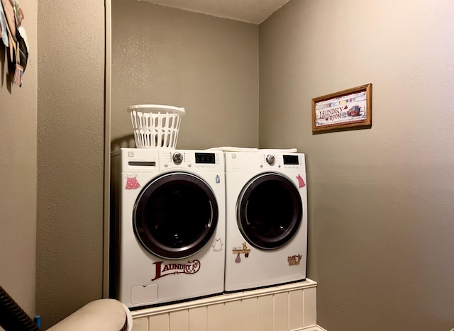 laundry room with washing machine and dryer and laundry area