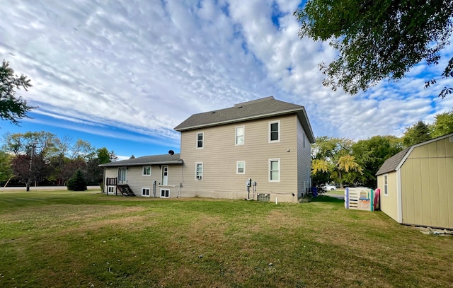 rear view of property with a lawn