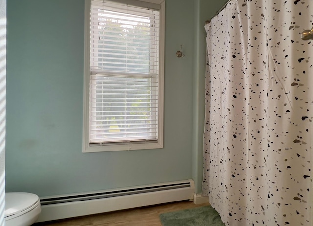 302 Dakota Ave, Hoffman, MN 56339 - bathroom with baseboard heating, plenty of natural light, and curtained shower
