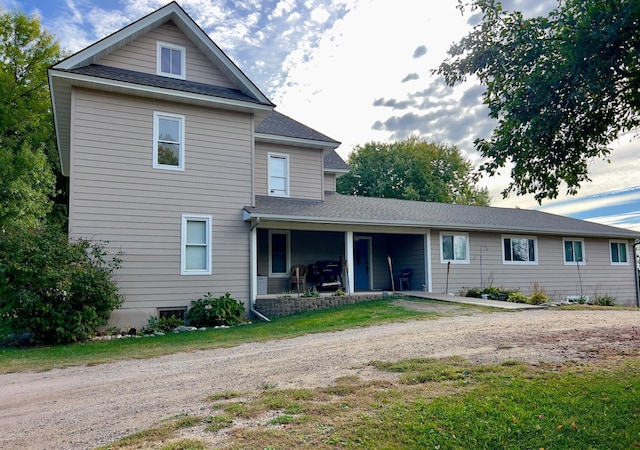 302 Dakota Ave, Hoffman, MN 56339 - back of property with a shingled roof, driveway, and a patio