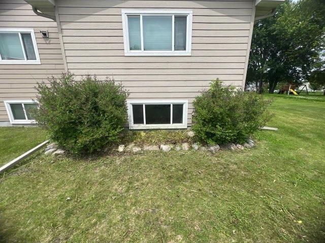 302 Dakota Ave, Hoffman, MN 56339 - view of property exterior with a lawn