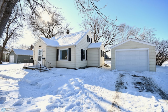 view of front of property with an outbuilding and a detached garage