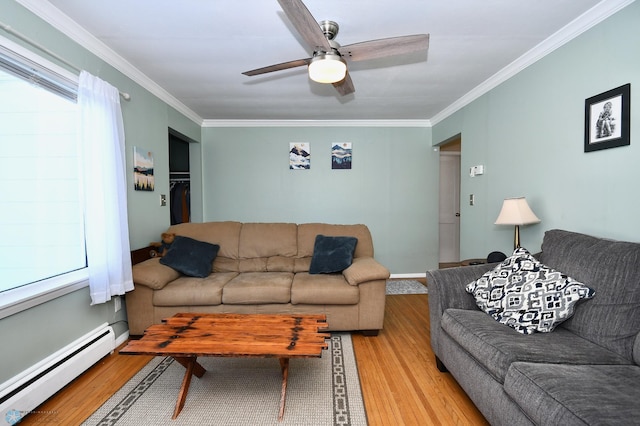 living area with crown molding, baseboard heating, and light wood-style floors