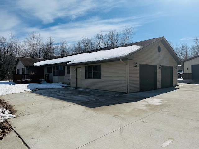 view of front of property with a garage and concrete driveway