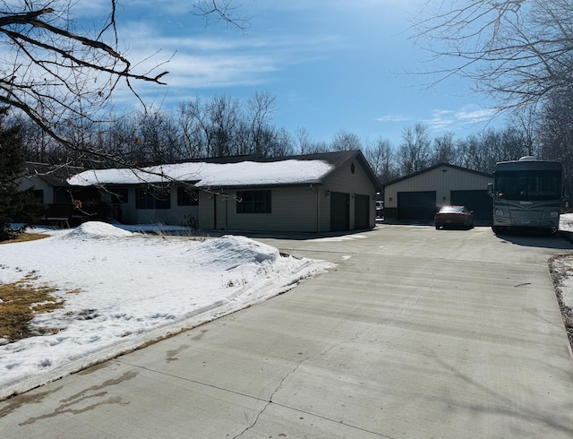 view of front of home with a detached garage