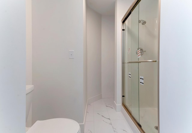15153 Cates Lake Dr, Prior Lake, MN 55372 - bathroom with marble look tile flooring, toilet, and a stall shower