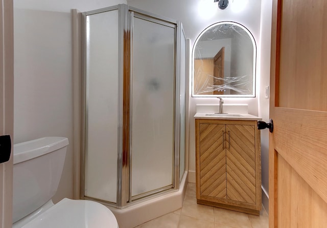 15153 Cates Lake Dr, Prior Lake, MN 55372 - bathroom with a shower stall, vanity, toilet, and tile patterned flooring