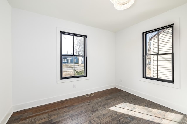 4129 Utica Ave S, Saint Louis Park, MN 55416 - spare room featuring healthy amount of natural light and dark wood-style flooring