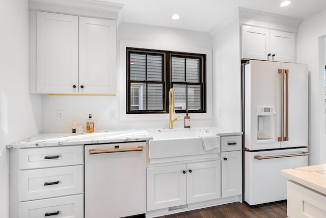 4129 Utica Ave S, Saint Louis Park, MN 55416 - kitchen featuring white appliances, white cabinets, light stone counters, dark wood-style floors, and recessed lighting