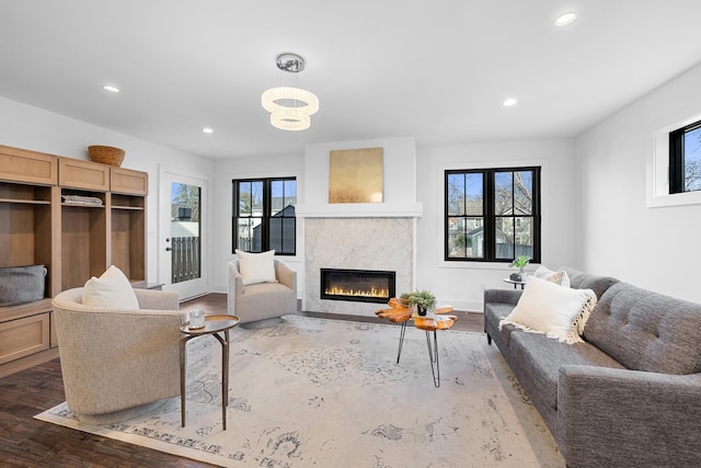 4129 Utica Ave S, Saint Louis Park, MN 55416 - living room featuring dark wood-style floors, recessed lighting, a premium fireplace, and a chandelier