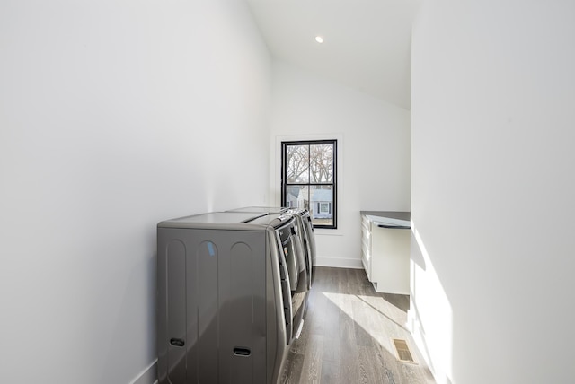 4129 Utica Ave S, Saint Louis Park, MN 55416 - hall with washing machine and clothes dryer, dark wood-style floors, lofted ceiling, and recessed lighting