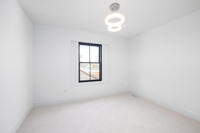4129 Utica Ave S, Saint Louis Park, MN 55416 - carpeted spare room with a chandelier and baseboards