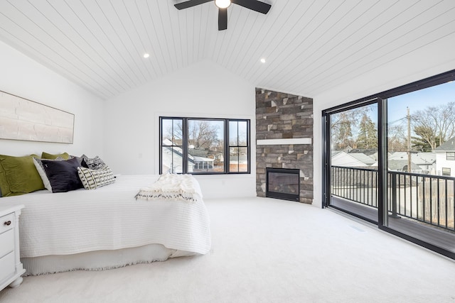 4129 Utica Ave S, Saint Louis Park, MN 55416 - bedroom featuring access to outside, vaulted ceiling, multiple windows, carpet floors, and a fireplace