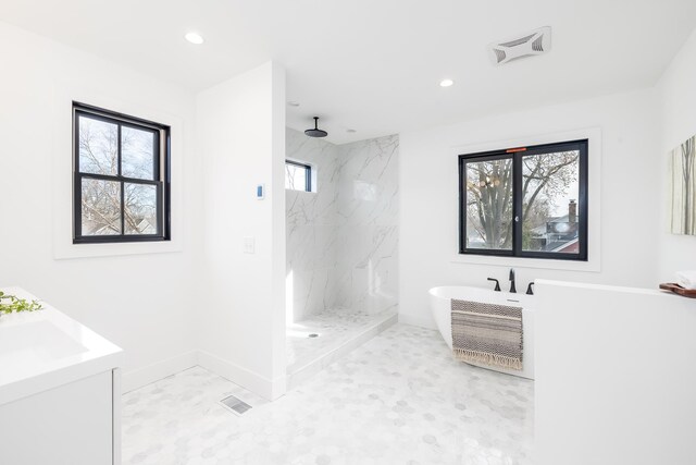 4129 Utica Ave S, Saint Louis Park, MN 55416 - full bathroom featuring a marble finish shower, a freestanding bath, recessed lighting, and vanity