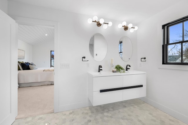4129 Utica Ave S, Saint Louis Park, MN 55416 - ensuite bathroom featuring double vanity and lofted ceiling