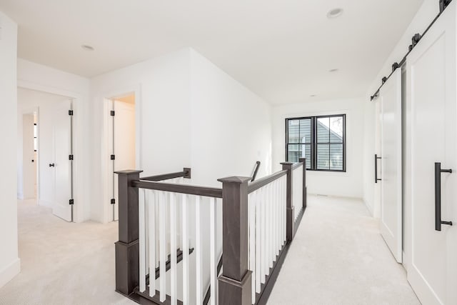 4129 Utica Ave S, Saint Louis Park, MN 55416 - corridor with light carpet, an upstairs landing, and a barn door