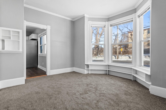 interior space featuring baseboards, dark carpet, and crown molding