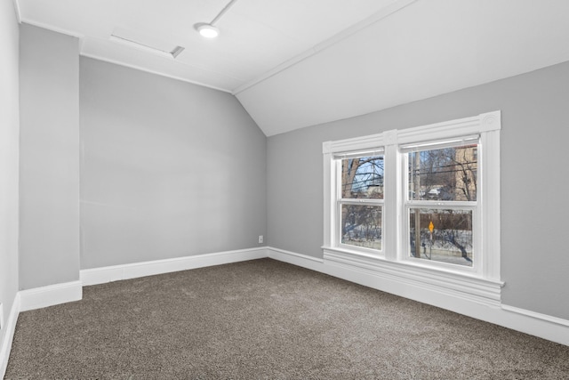 bonus room with lofted ceiling, carpet, attic access, and baseboards