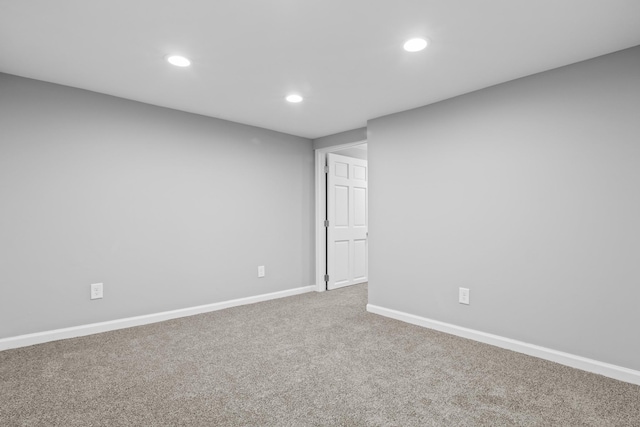 carpeted spare room with baseboards and recessed lighting