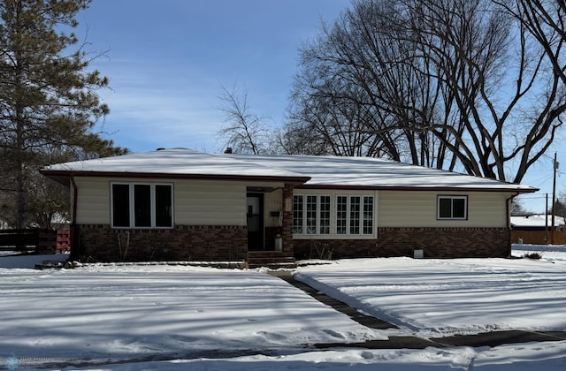 view of front of property featuring brick siding