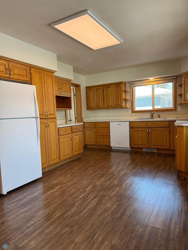 kitchen with light countertops, white appliances, brown cabinets, and open shelves