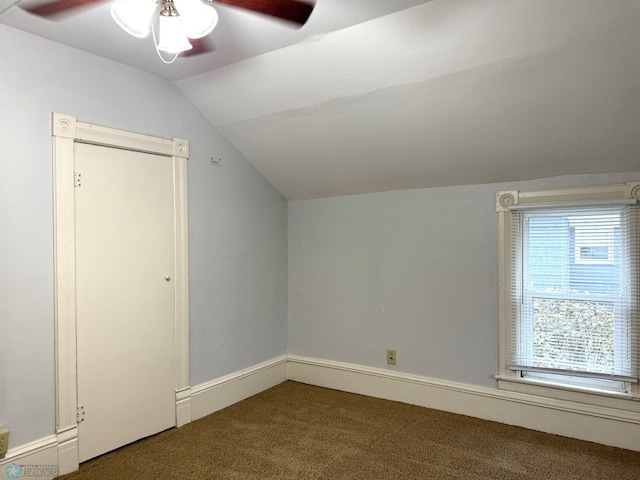 bonus room with lofted ceiling, baseboards, ceiling fan, and carpet