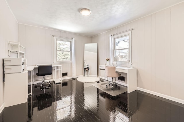 office area featuring ornamental molding, wood finished floors, and baseboards