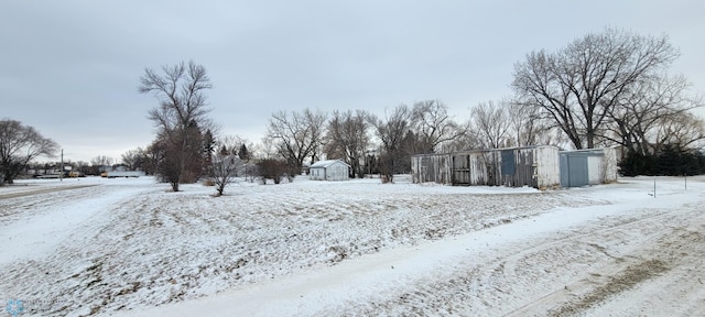 view of yard layered in snow