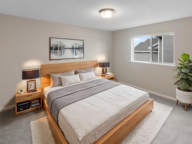 carpeted bedroom with baseboards