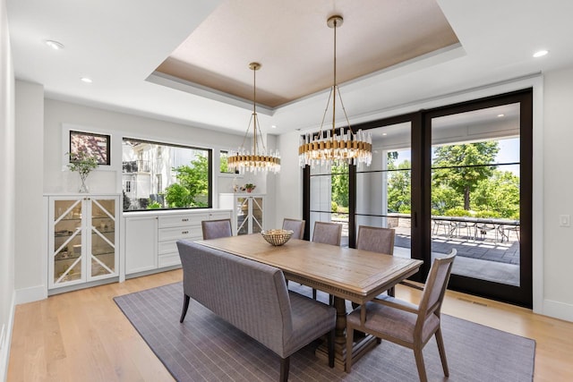 4889 Lake Harriet Pkwy, Minneapolis, MN 55419 - dining area featuring a raised ceiling, plenty of natural light, light wood-style floors, a chandelier, and recessed lighting