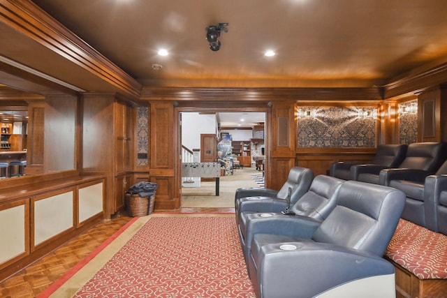 home theater featuring a decorative wall, recessed lighting, and crown molding