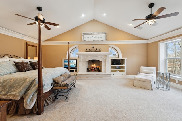 bedroom featuring baseboards, a premium fireplace, lofted ceiling, ornamental molding, and carpet flooring