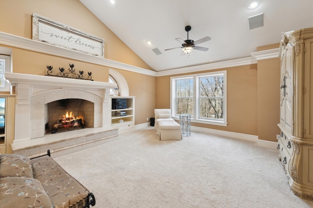 sitting room featuring baseboards, carpet floors, a fireplace, and crown molding