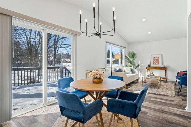 dining area featuring vaulted ceiling, wood finished floors, visible vents, and recessed lighting